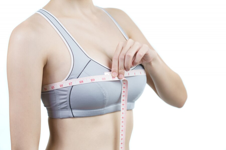 Woman considering breast implant surgery consultation at Cocoona Clinic